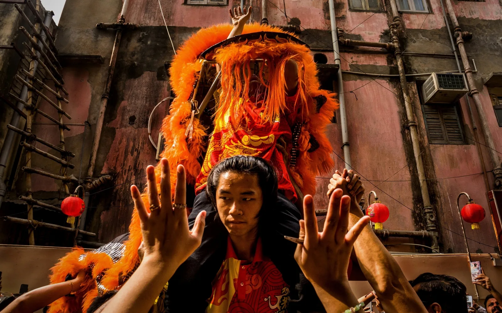 Asian community celebrating their cultural new year with traditional dress and festivities